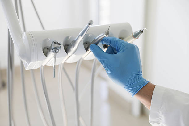 Professional Tooth Extraction technician working in Walled Lake, MI